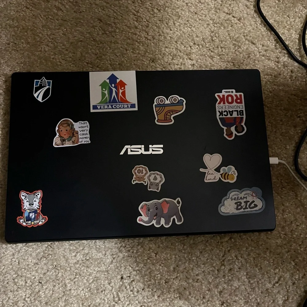 ASUS Black Laptop with Stickers